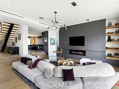 12132 Otsego Street Valley Village, CA 91607 - Photo 14 of 75 a living room with furniture and a flat screen tv