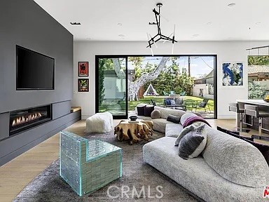12132 Otsego Street Valley Village, CA 91607 - Photo 15 of 75 a living room with furniture and a flat screen tv