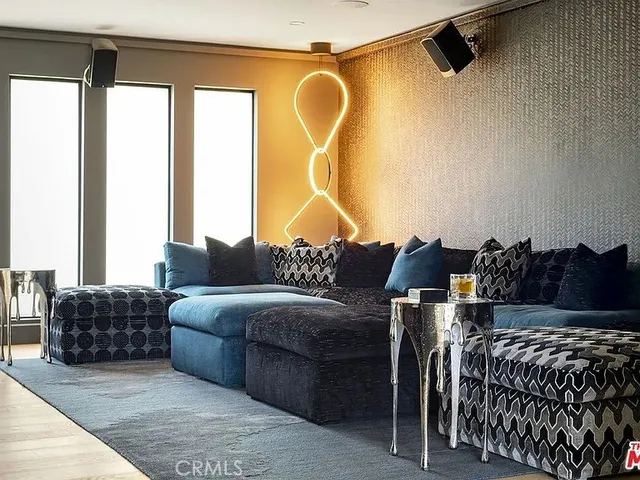 a bedroom with a large bed and a couch