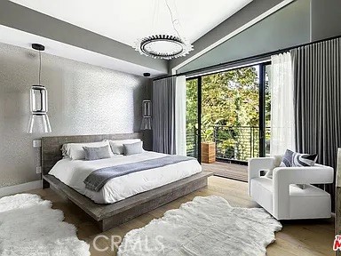 12132 Otsego Street Valley Village, CA 91607 - Photo 30 of 75 a bedroom with a large bed and a couch