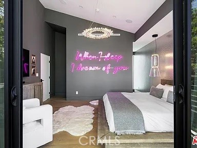 12132 Otsego Street Valley Village, CA 91607 - Photo 33 of 75 a bedroom with a bed and a flat screen tv