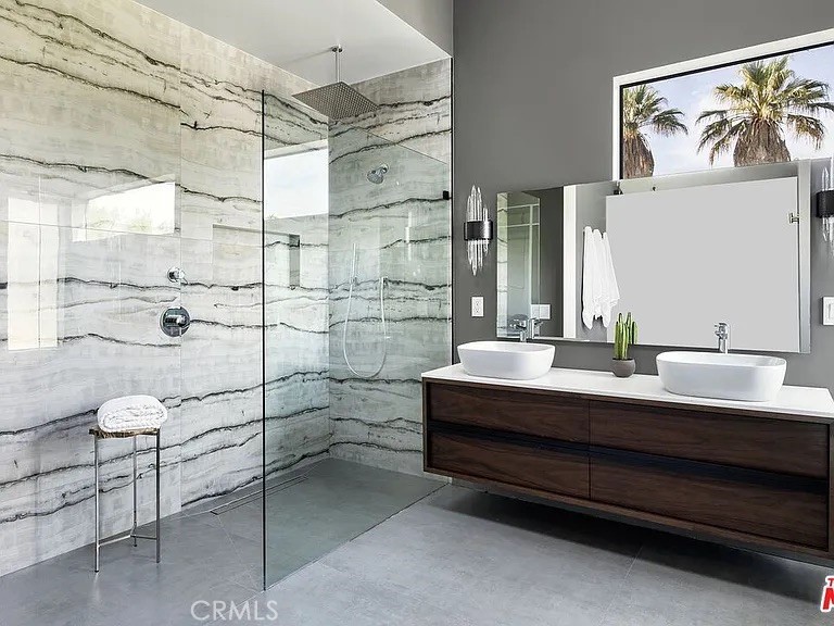 12132 Otsego Street Valley Village, CA 91607 - Photo 34 of 75 a bathroom with a double vanity sink a mirror and shower