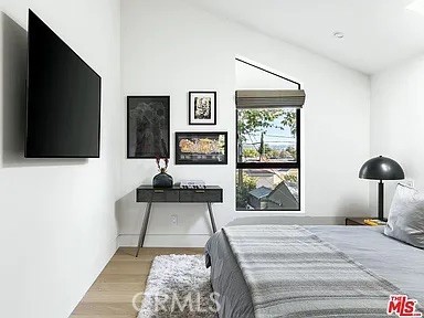 12132 Otsego Street Valley Village, CA 91607 - Photo 39 of 75 a bedroom with a bed and a flat screen tv