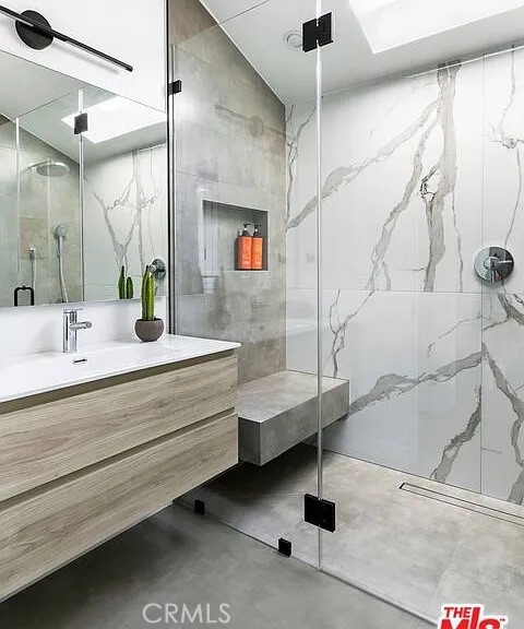 12132 Otsego Street Valley Village, CA 91607 - Photo 40 of 75 a bathroom with a sink and a mirror