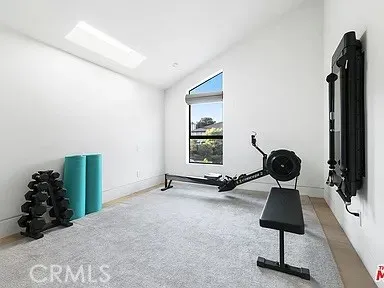a white bath tub sitting next to a white toilet