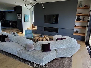 12132 Otsego Street Valley Village, CA 91607 - Photo 51 of 75 a living room with furniture and a flat screen tv