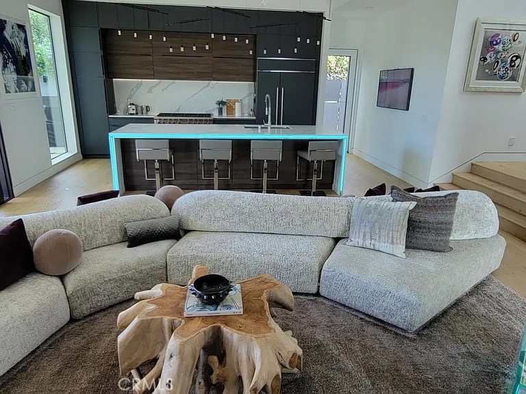 12132 Otsego Street Valley Village, CA 91607 - Photo 52 of 75 a living room with furniture and a fireplace