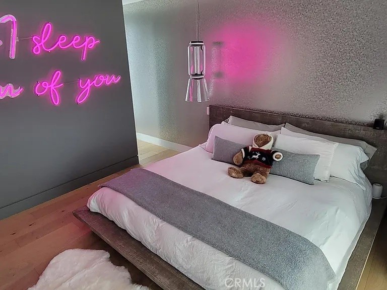 12132 Otsego Street Valley Village, CA 91607 - Photo 58 of 75 a bedroom with a bed and a potted plant