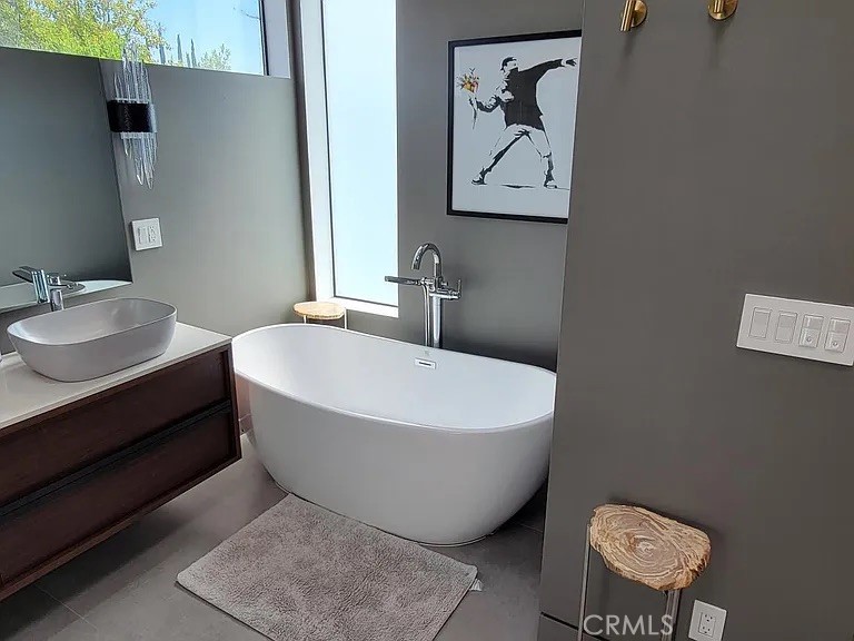 12132 Otsego Street Valley Village, CA 91607 - Photo 61 of 75 a white bath tub sitting next to a white toilet