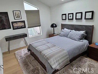 12132 Otsego Street Valley Village, CA 91607 - Photo 63 of 75 a bedroom with a bed and a painting on the wall