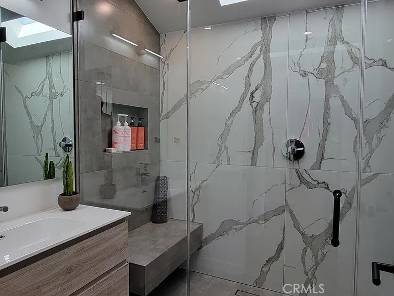 12132 Otsego Street Valley Village, CA 91607 - Photo 64 of 75 a bathroom with a granite countertop sink a toilet and shower