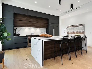 12132 Otsego Street Valley Village, CA 91607 - Photo 75 of 75 a kitchen with a sink cabinets and appliances