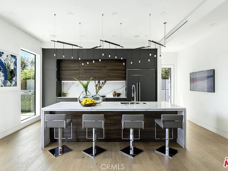 12132 Otsego Street Valley Village, CA 91607 - Photo 10 of 75 a kitchen with a table and chairs in it