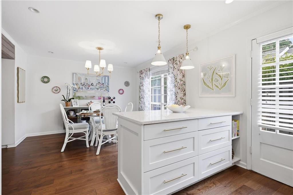 24 Independence Place Northwest Atlanta, GA 30318 - Photo 12 of 28 a view of a dining room and livingroom with furniture wooden floor a chandelier