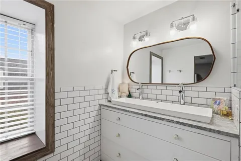 a bathroom with a sink and a mirror