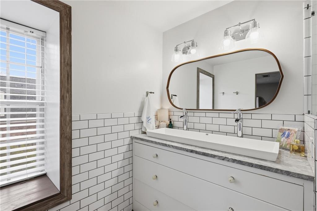 24 Independence Place Northwest Atlanta, GA 30318 - Photo 17 of 28 a bathroom with a sink and a mirror