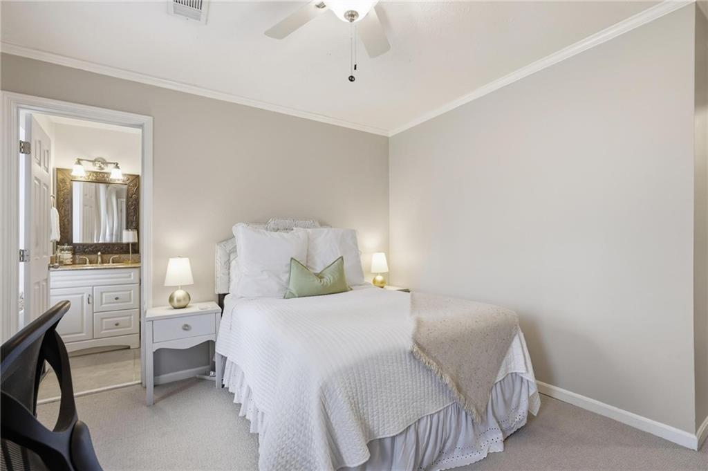 24 Independence Place Northwest Atlanta, GA 30318 - Photo 20 of 28 a bedroom with a bed and a chandelier