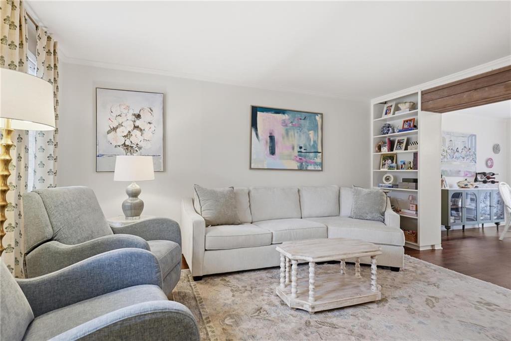 24 Independence Place Northwest Atlanta, GA 30318 - Photo 2 of 28 a living room with furniture a rug and a wall painting
