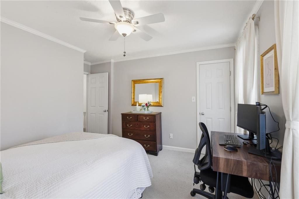 24 Independence Place Northwest Atlanta, GA 30318 - Photo 22 of 28 a bedroom with a bed and a desk
