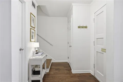 a view of entryway with wooden floor and stairs