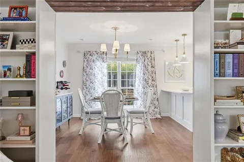 a living room with furniture and a book shelf