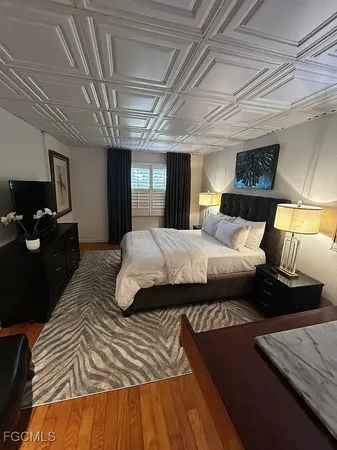 a bedroom with a bed and a dresser