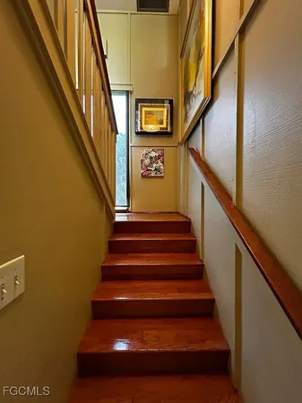 a view of an entryway with wooden floor