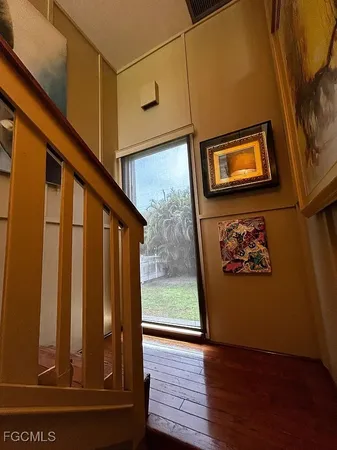a view of stairs and with wooden floor