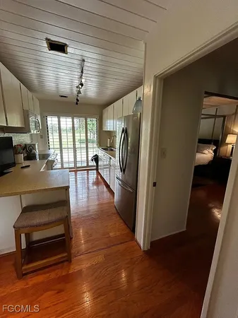 a bedroom with a bed and a mirror