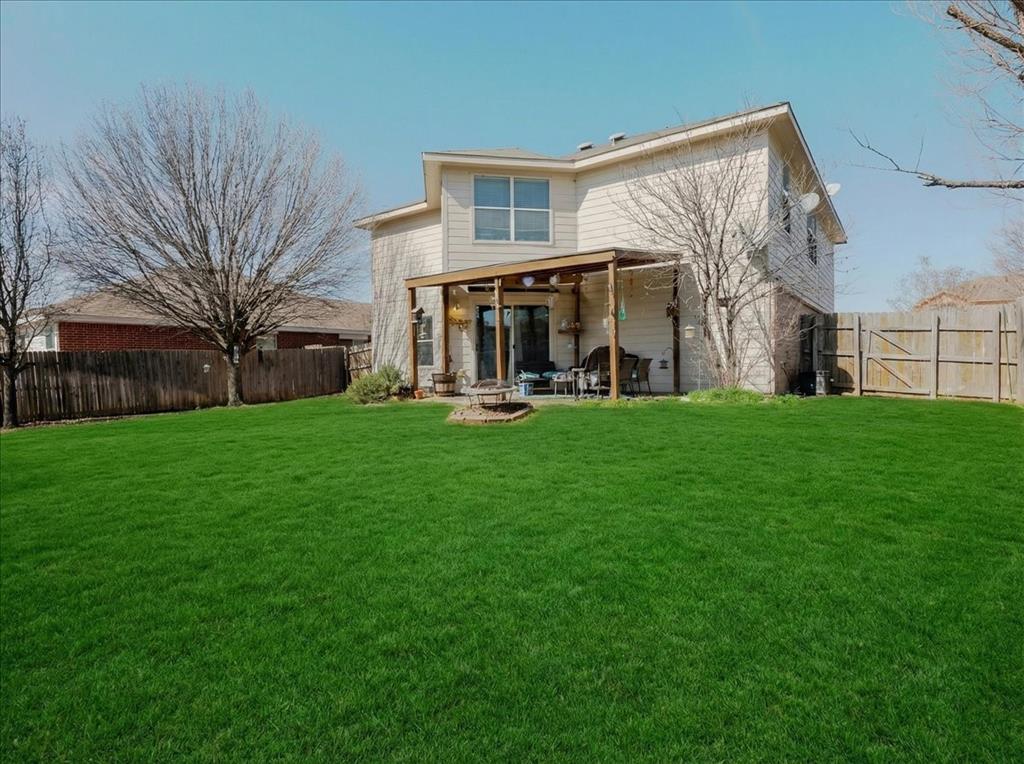 1606 Withers Way Krum, TX 76249 - Photo 23 of 35 a view of a house with a yard and sitting area