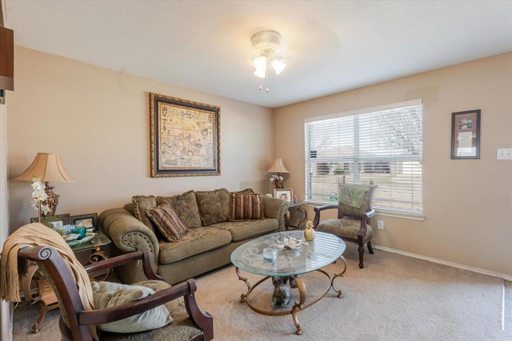 1606 Withers Way Krum, TX 76249 - Photo 28 of 35 a living room with furniture and a large window