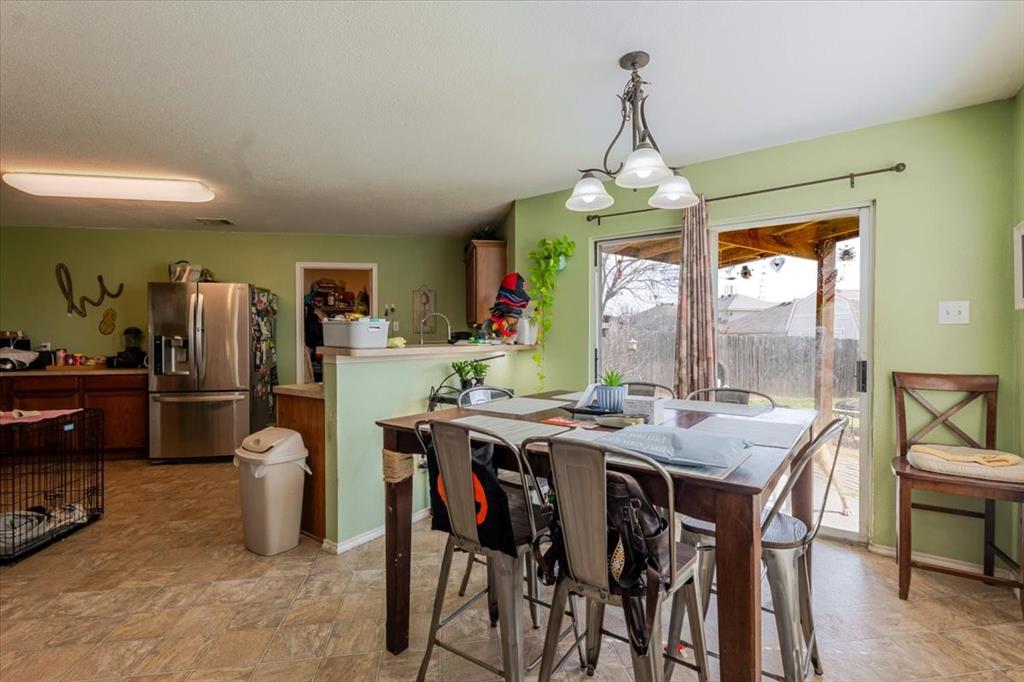 1606 Withers Way Krum, TX 76249 - Photo 33 of 35 a view of a dining room with furniture window and outside view