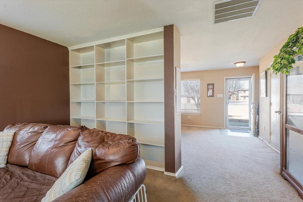 1606 Withers Way Krum, TX 76249 - Photo 4 of 35 a bedroom with a bed and a window