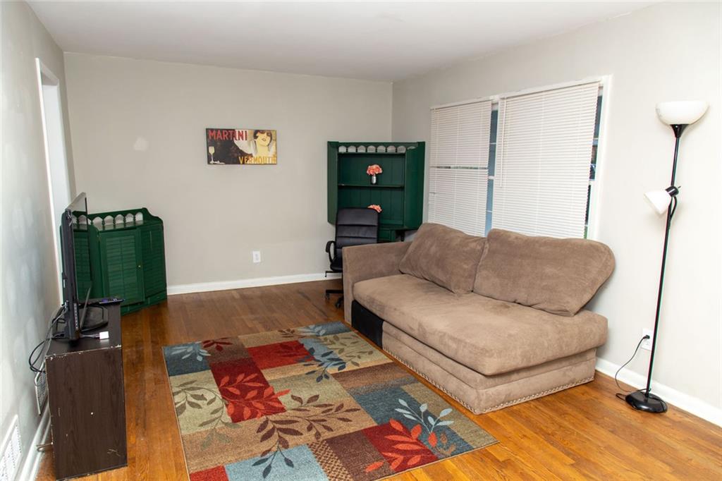 1681 Atherton Circle Decatur, GA 30035 - Photo 5 of 17 a living room with furniture and a wooden floor