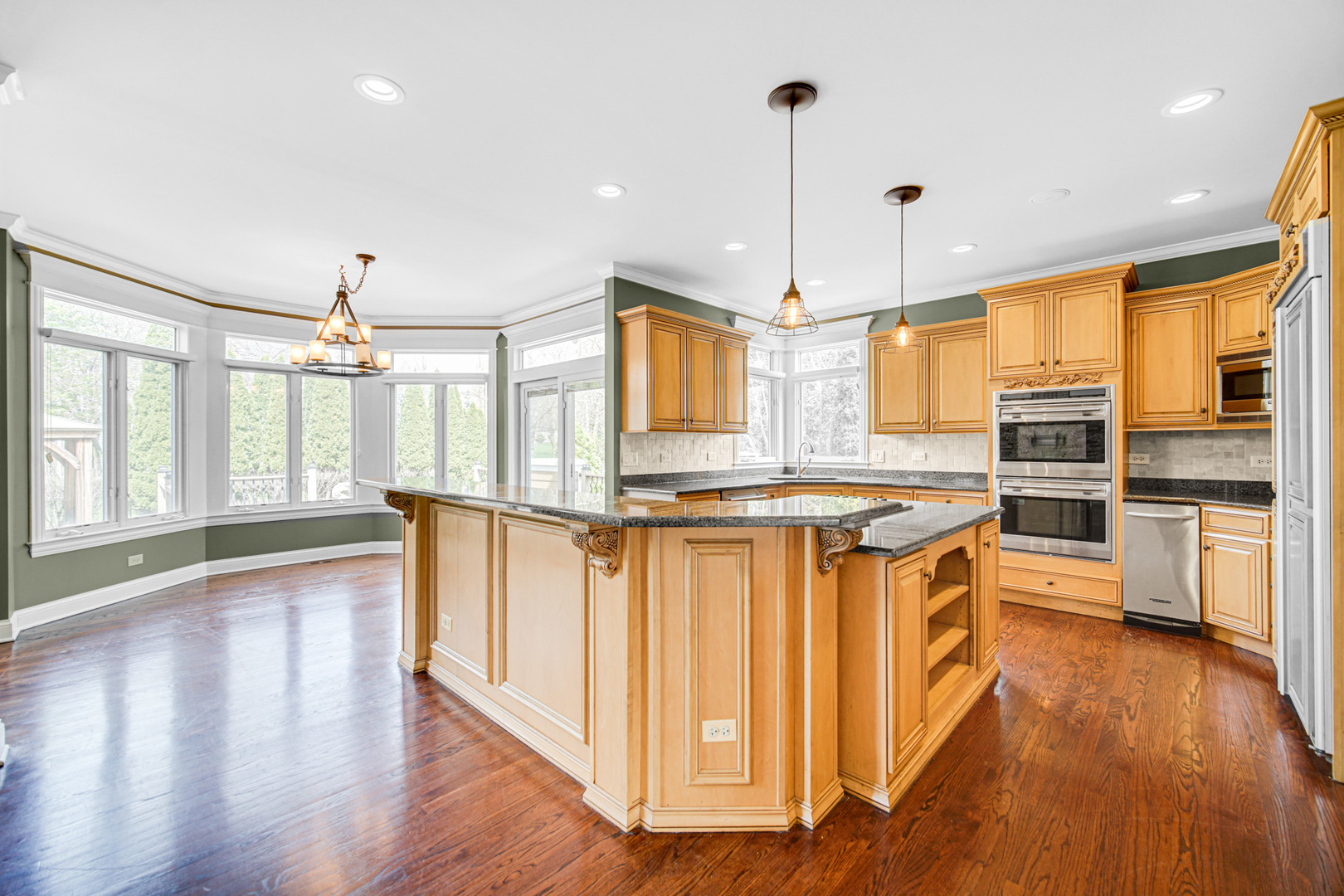 3N777 Walt Whitman Road St. Charles, IL 60175 - Photo 5 of 29 a kitchen with stainless steel appliances granite countertop a refrigerator a stove and a wooden floors
