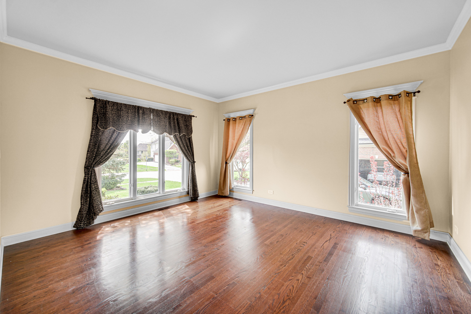 3N777 Walt Whitman Road St. Charles, IL 60175 - Photo 7 of 29 an empty room with wooden floor and windows
