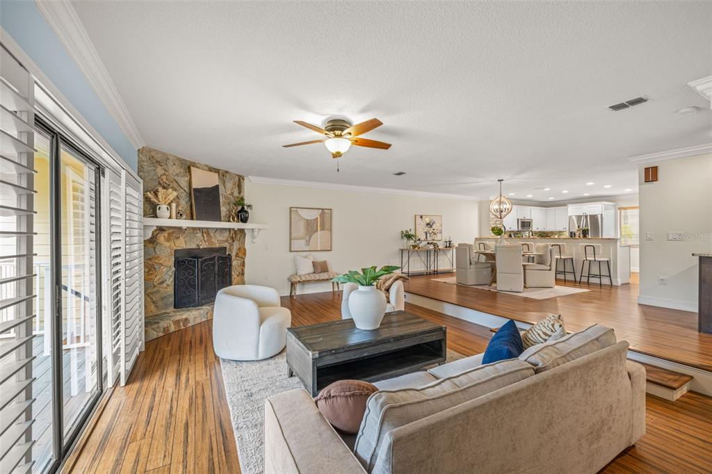 533 Sandy Hook Road Treasure Island, FL 33706 - Photo 13 of 46 a living room with furniture fireplace and flat screen tv