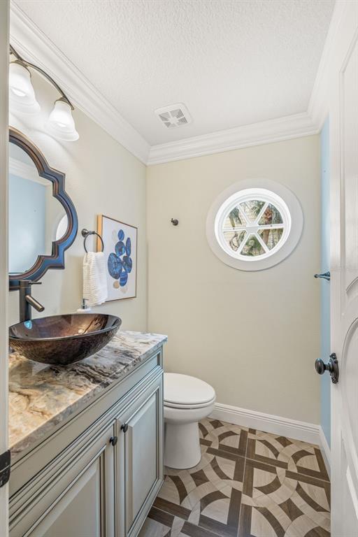 533 Sandy Hook Road Treasure Island, FL 33706 - Photo 18 of 46 a view of a bathroom with toilet and a sink