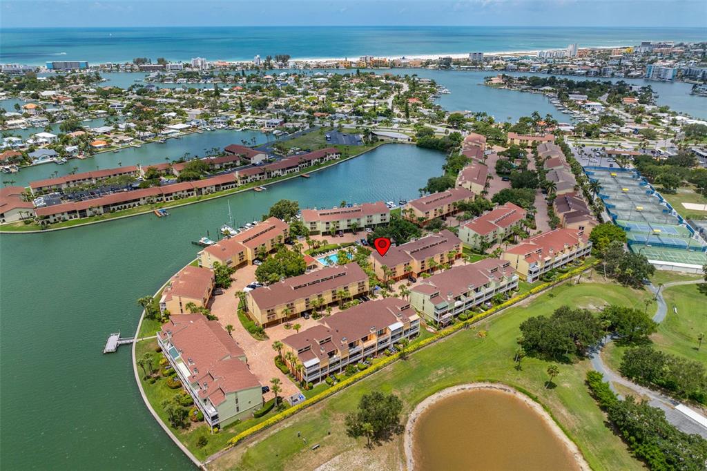 533 Sandy Hook Road Treasure Island, FL 33706 - Photo 2 of 46 an aerial view of a house with a lake view
