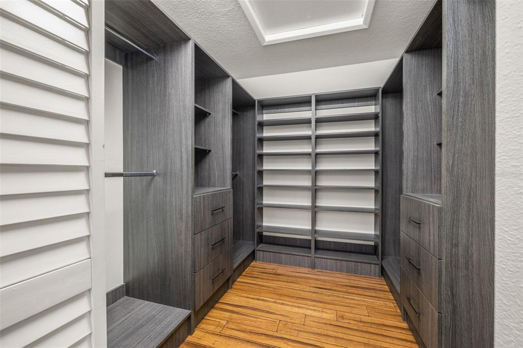 533 Sandy Hook Road Treasure Island, FL 33706 - Photo 24 of 46 a view of walk in closet with empty racks
