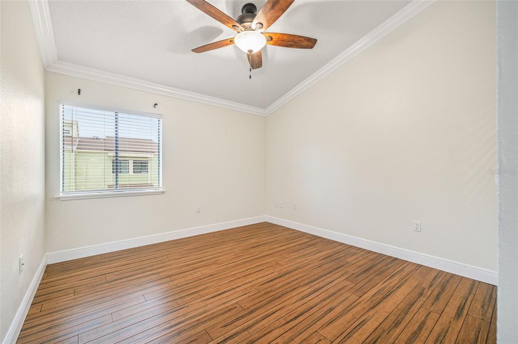 533 Sandy Hook Road Treasure Island, FL 33706 - Photo 25 of 46 wooden floor in an empty room with a window