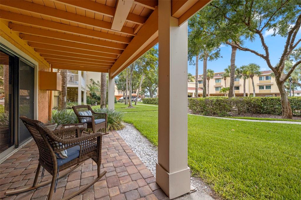533 Sandy Hook Road Treasure Island, FL 33706 - Photo 31 of 46 a patio with yard table and chairs