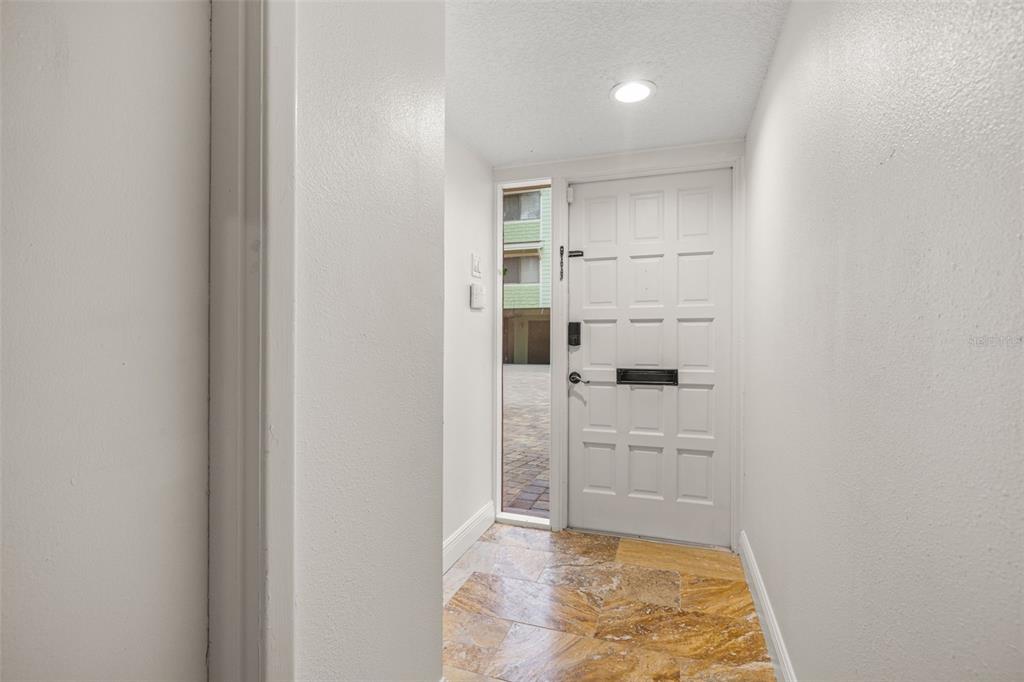 533 Sandy Hook Road Treasure Island, FL 33706 - Photo 6 of 46 a view of cabinets and entryway