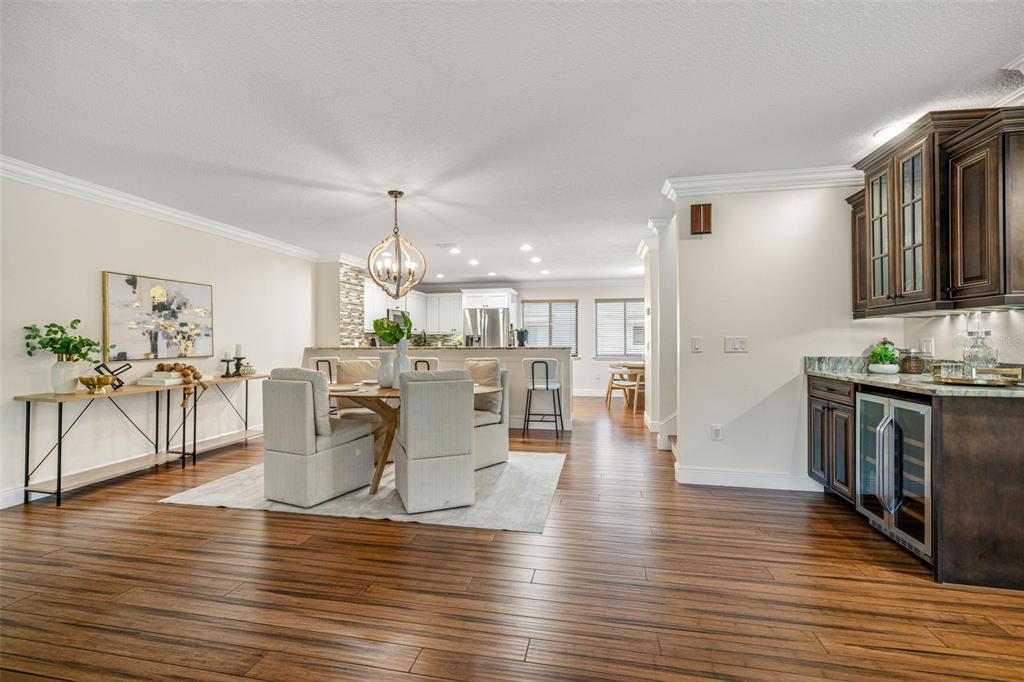 533 Sandy Hook Road Treasure Island, FL 33706 - Photo 8 of 46 a view of a dining room with furniture window and wooden floor