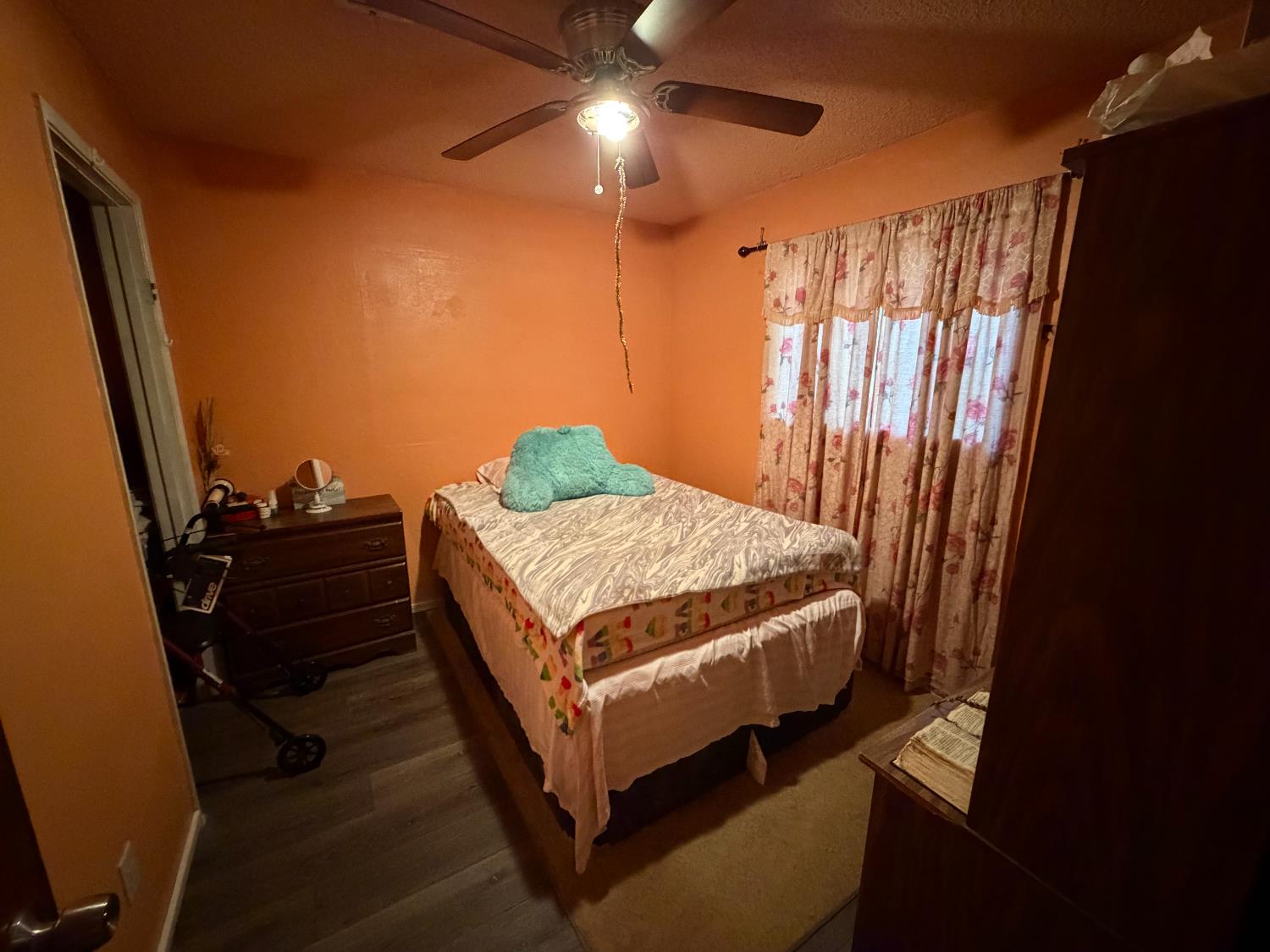 8767 South Rodriguez Avenue Parlier, CA 93648 - Photo 12 of 18 a bedroom with a bed and a mirror