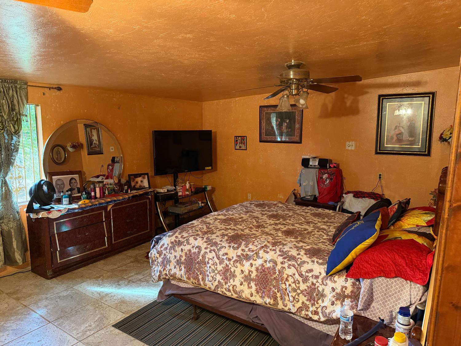8767 South Rodriguez Avenue Parlier, CA 93648 - Photo 13 of 18 a bed room with a bed and a television