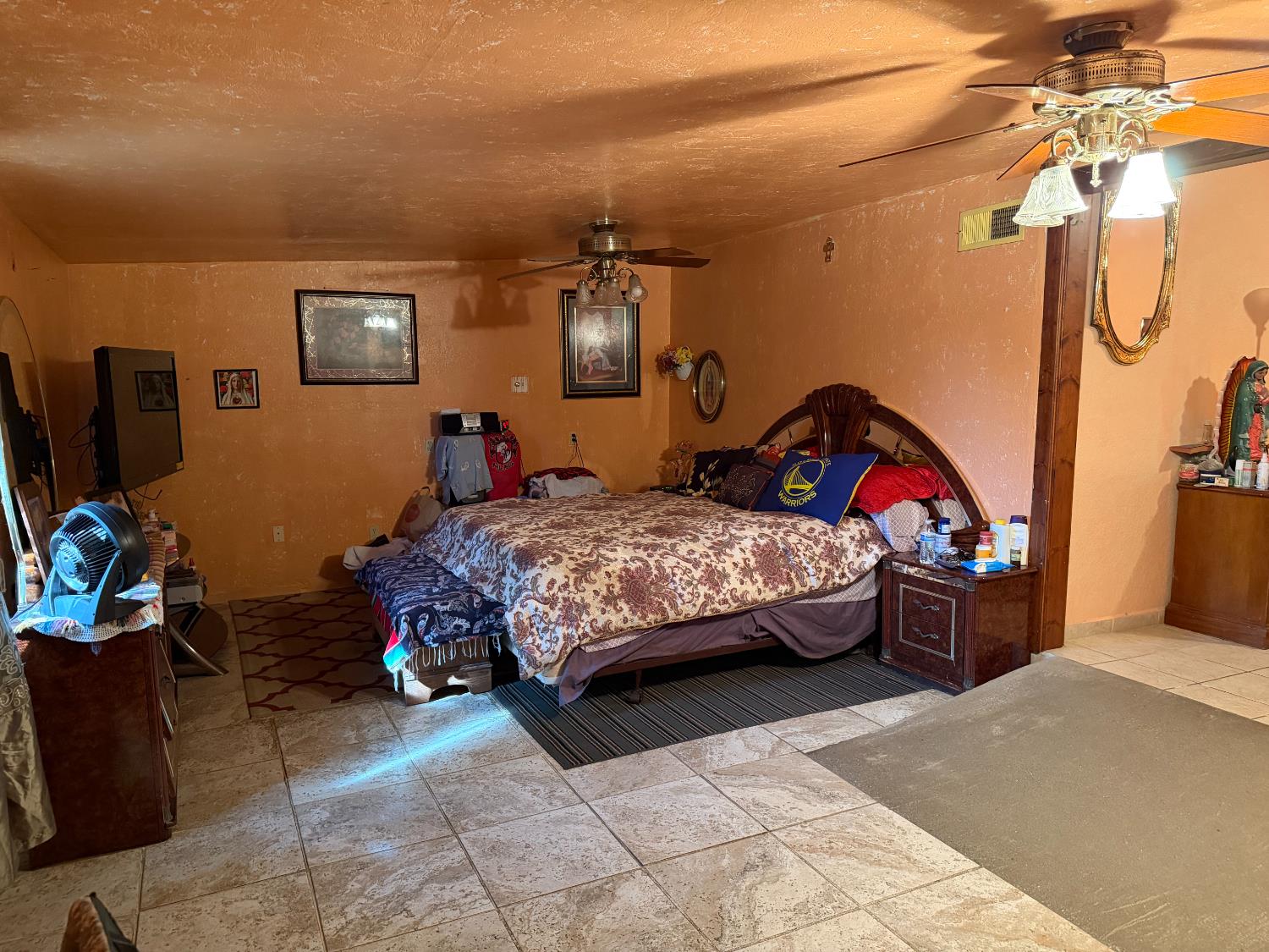 8767 South Rodriguez Avenue Parlier, CA 93648 - Photo 14 of 18 a bedroom with a bed and a view of bathroom