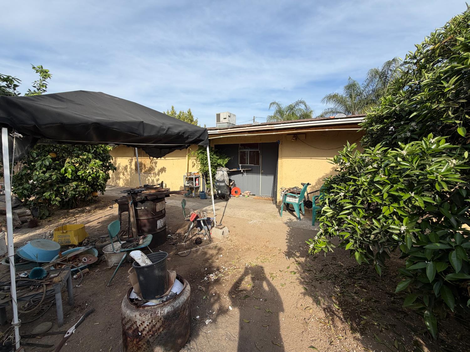 8767 South Rodriguez Avenue Parlier, CA 93648 - Photo 18 of 18 a view of a patio with table and chairs under an umbrella
