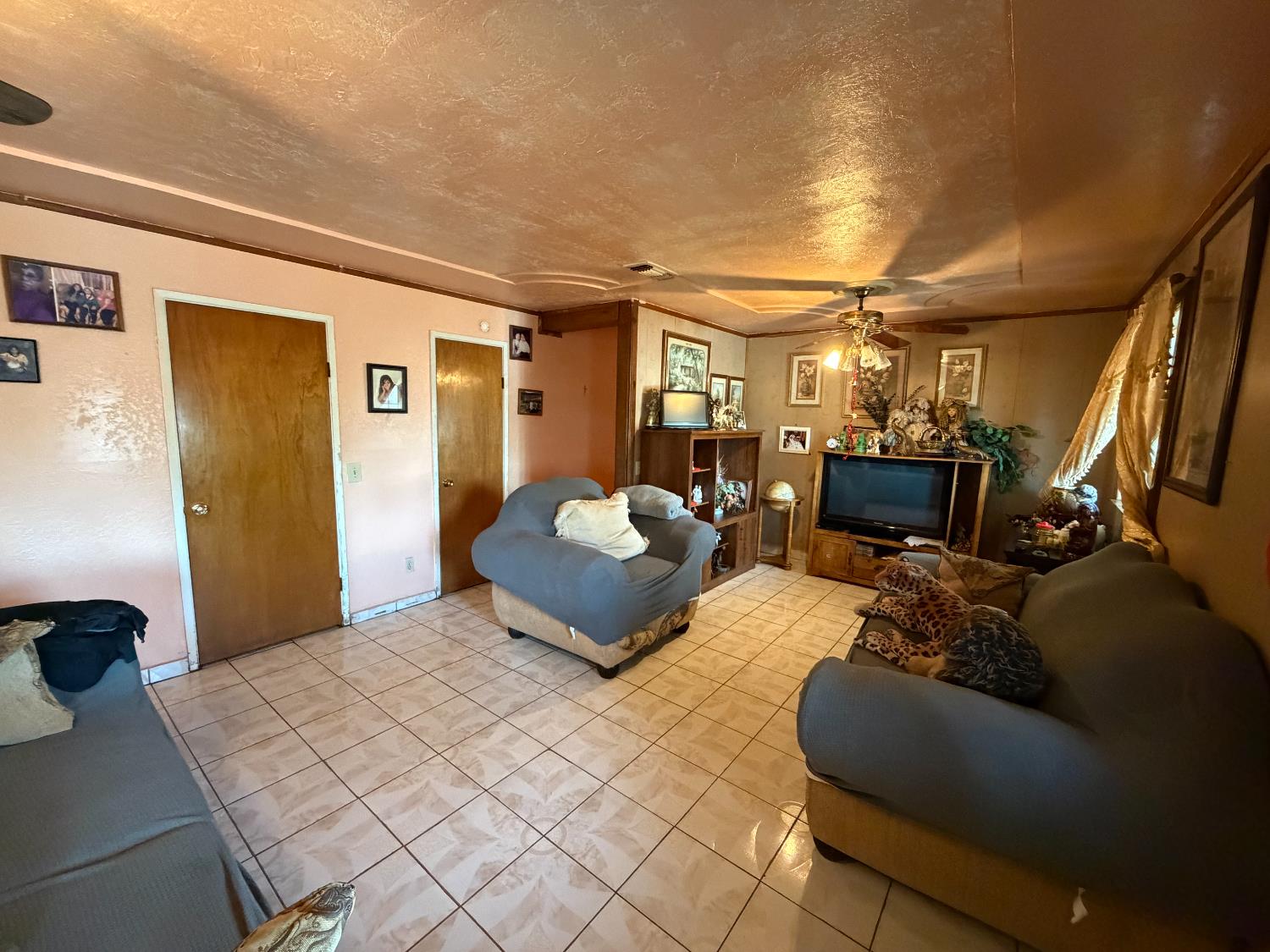 8767 South Rodriguez Avenue Parlier, CA 93648 - Photo 4 of 18 a bedroom with furniture and a large window