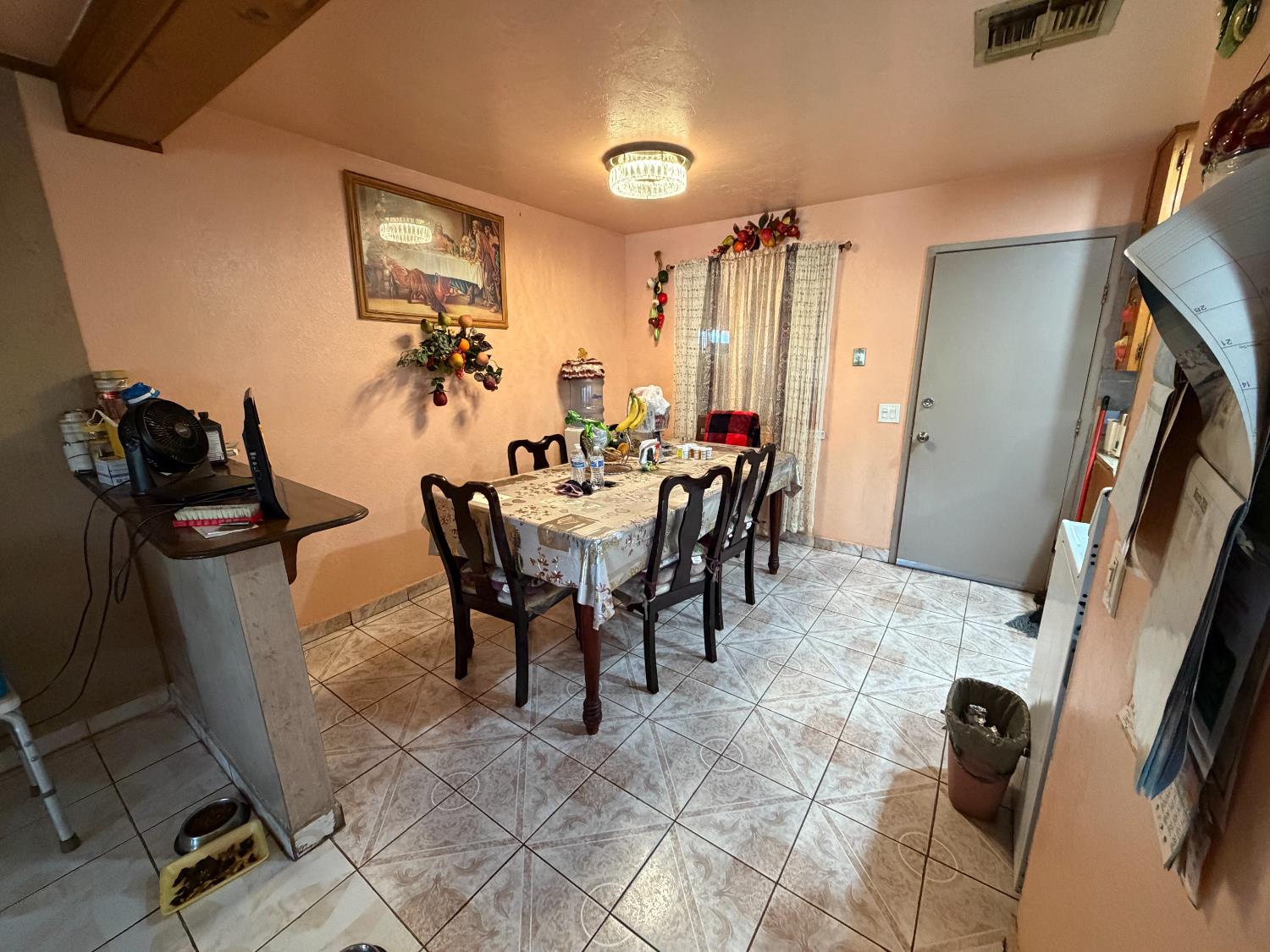 8767 South Rodriguez Avenue Parlier, CA 93648 - Photo 5 of 18 a view of a dining room with furniture and a kitchen